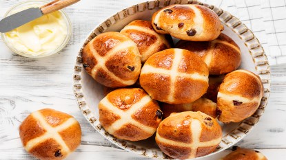Hot cross buns for Good Friday in a serving bowl