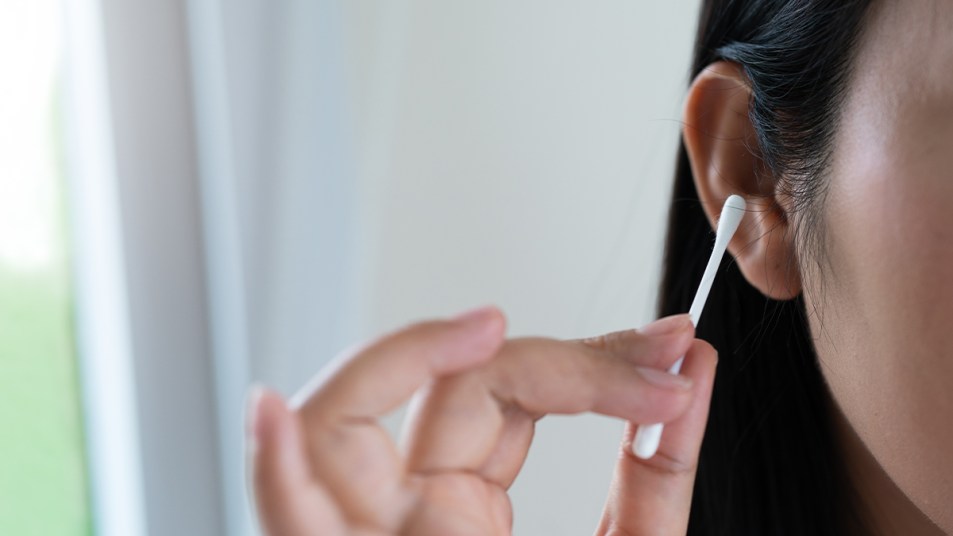 Woman holding a cotton swab