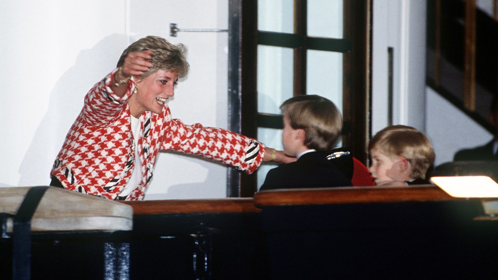 Princess Diana with arms out to hug young William and Harry
