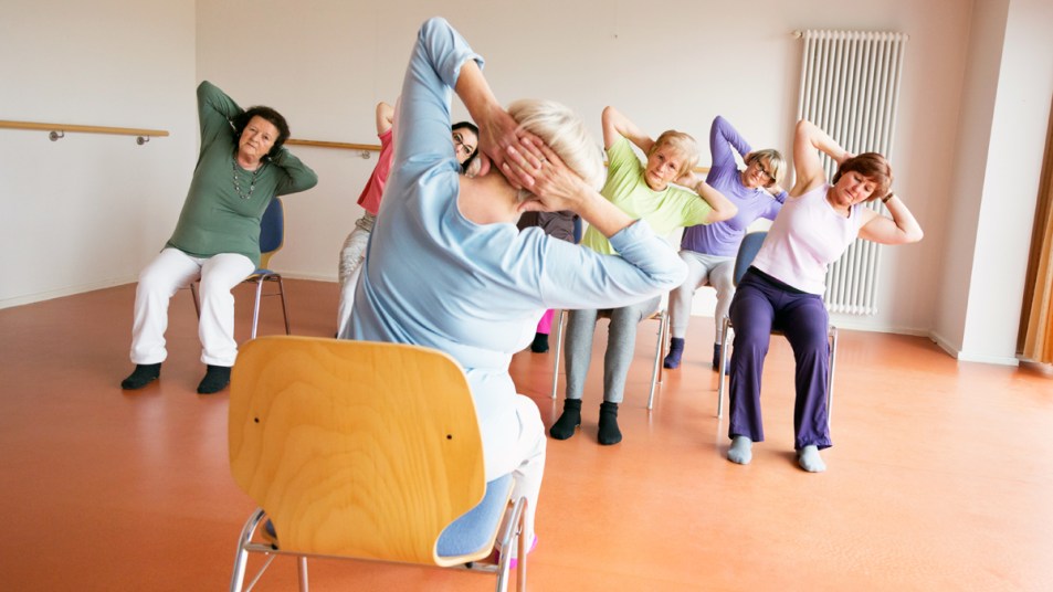 Group of women doing chair yoga