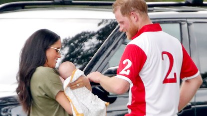 Prince Harry and Meghan holding Archie