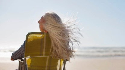 woman with gray hair on beach