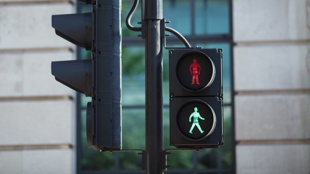 A traffic light with a green walk symbol