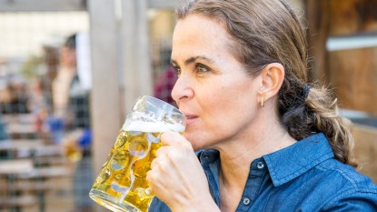 Woman sipping beer