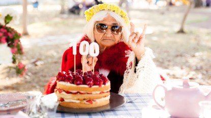 Woman with 100th birthday cake