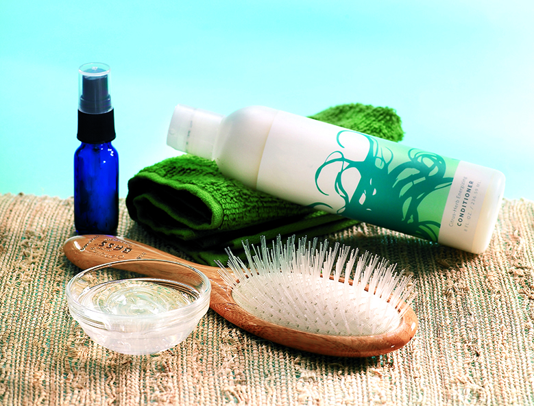 A spray bottle, aloe vera gel and a bottle of conditioner; all ingredients that you need to make a leave-in conditioner spray
