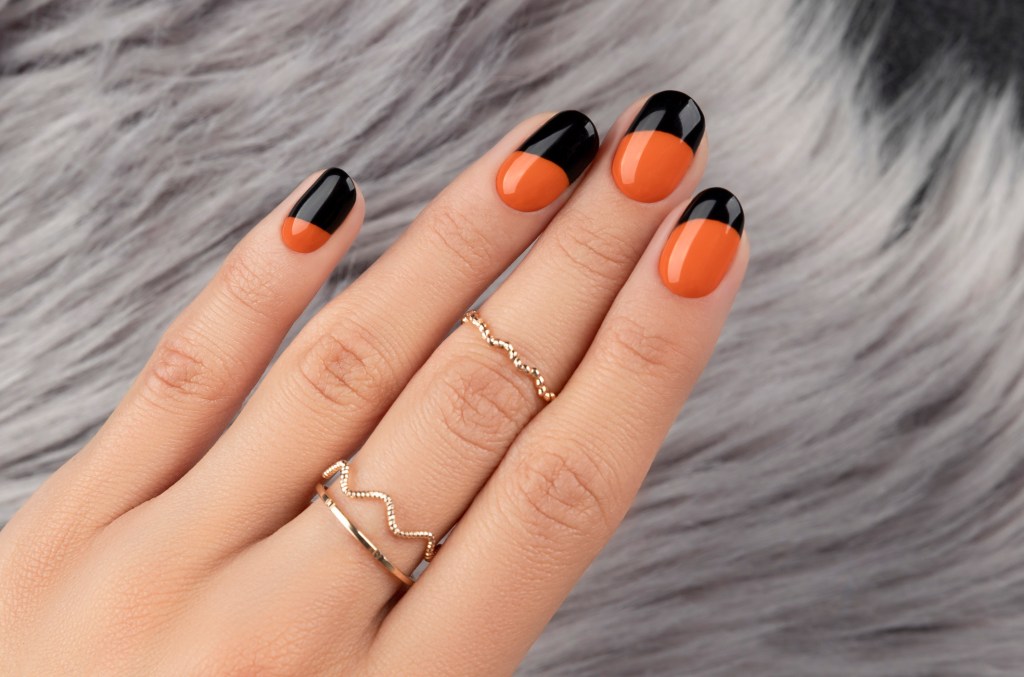Black and orange color block Halloween nail designs