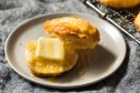 A buttermilk biscuit with butter and honey as part of a guide on making two ingredient biscuits
