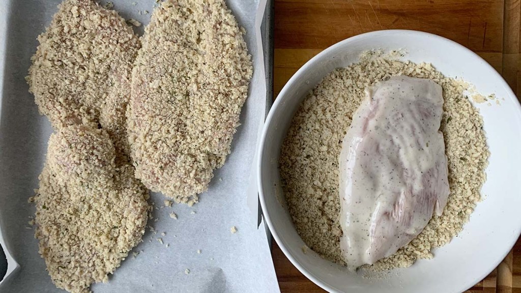 Ranch chicken cutlets during the breading stage