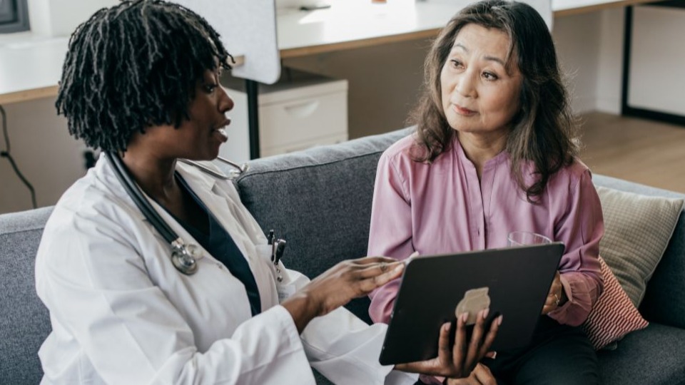 woman and her doctor discussing dementia test results