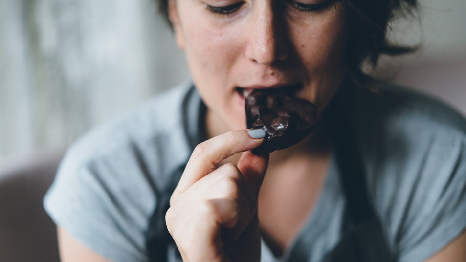woman eating dark chocolate