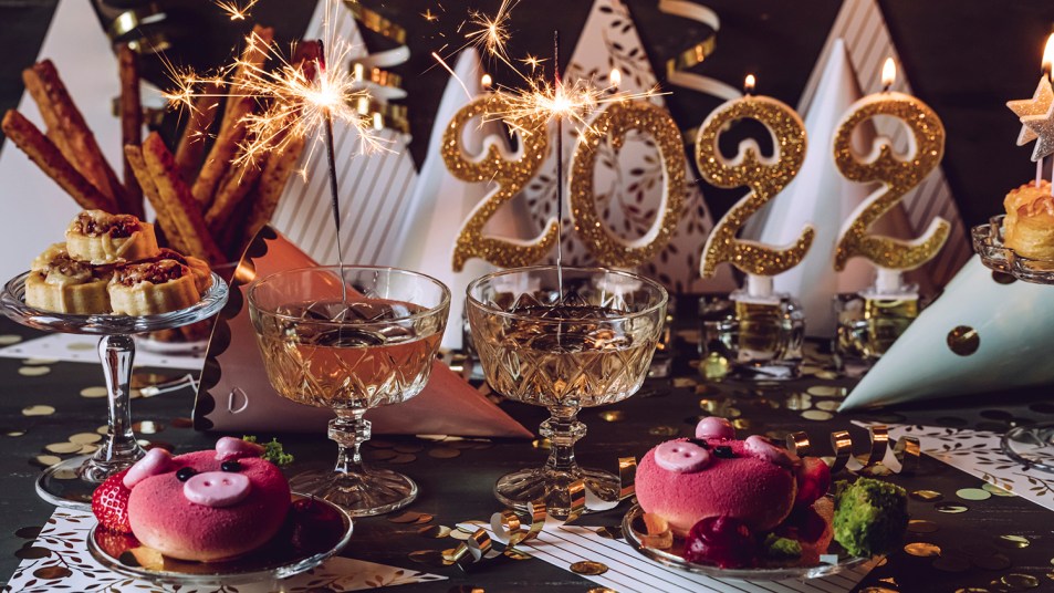 new year's eve celebration spread with wine and treats
