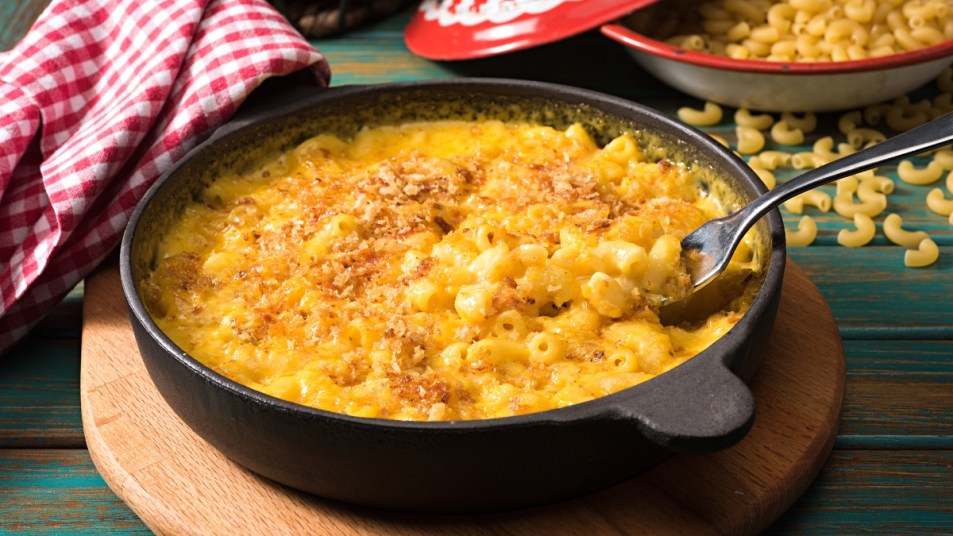 close up of mac and cheese in an iron bowl
