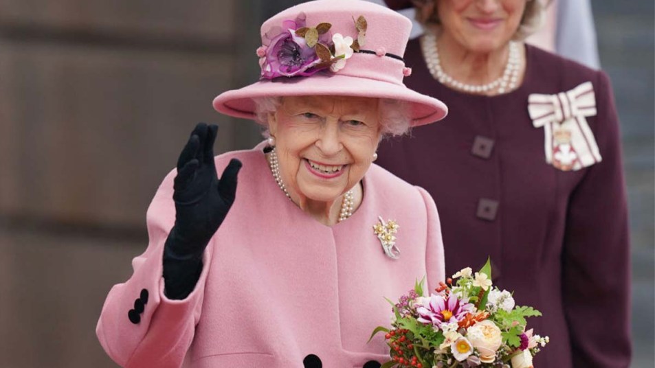 Queen Elizabeth waving to a crowd