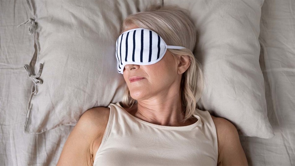 Woman sleeping with an eye mask