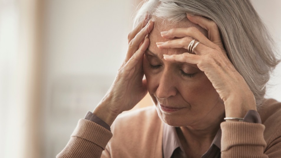 mature woman with a migraine