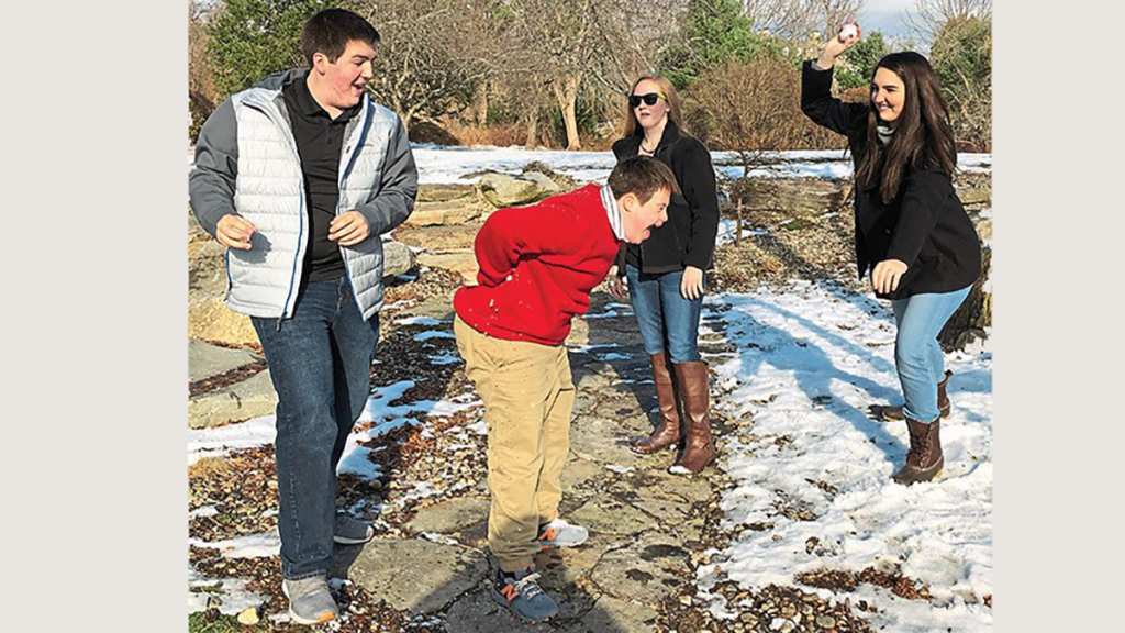 Jake having a snowball fight with his brother and sisters.
