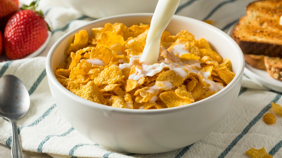 corn flakes in a bowl with milk