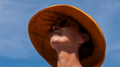 woman wearing sunglasses and a hat