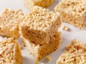 Sqaures of Rice Krispie treats as part of a guide on how to keep them soft