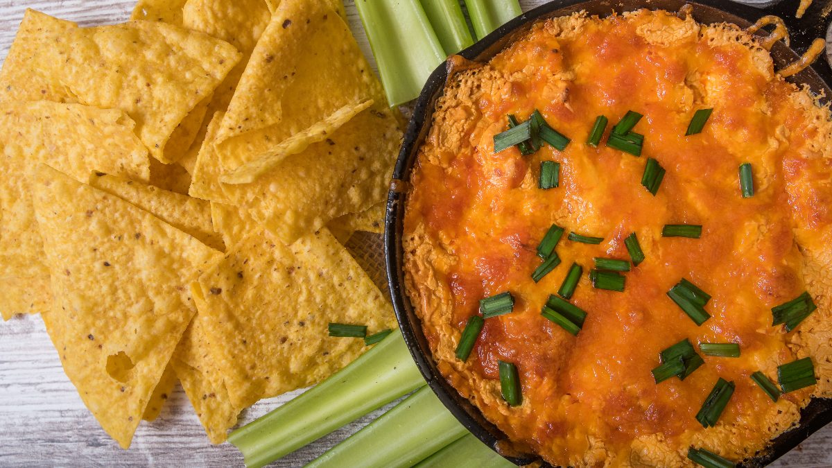 barbecue chicken dip with chips and celery