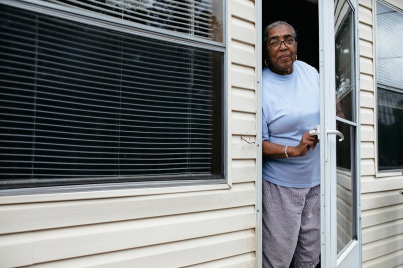 Elderly woman at her front door