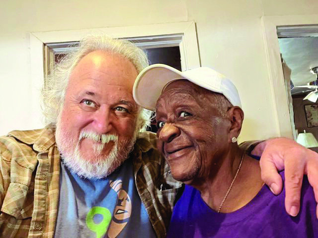 Kyle Caldwell, founder of Neighbor in Need, with a client