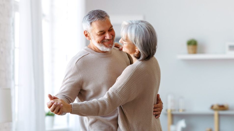 senior couple dancing together, concept for 'optimism linked to living longer'