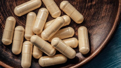B-complex-vitamin-supplements in a vintage-dark-colored-bowl