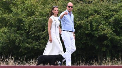 Prince William and Duchess Kate walking with dog