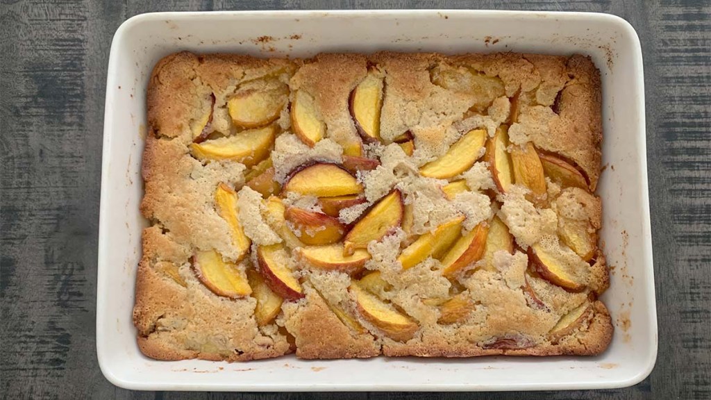 Lazy-peach-cobbler-fresh-out-of-the-oven-and-placed-on-dining-table
