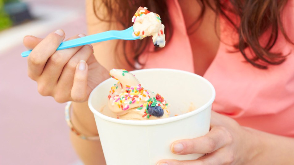 woman eating frozen yogurt