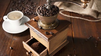 A-hand-crank-box-coffee-grinder-with-a-top-crank-and-hopper