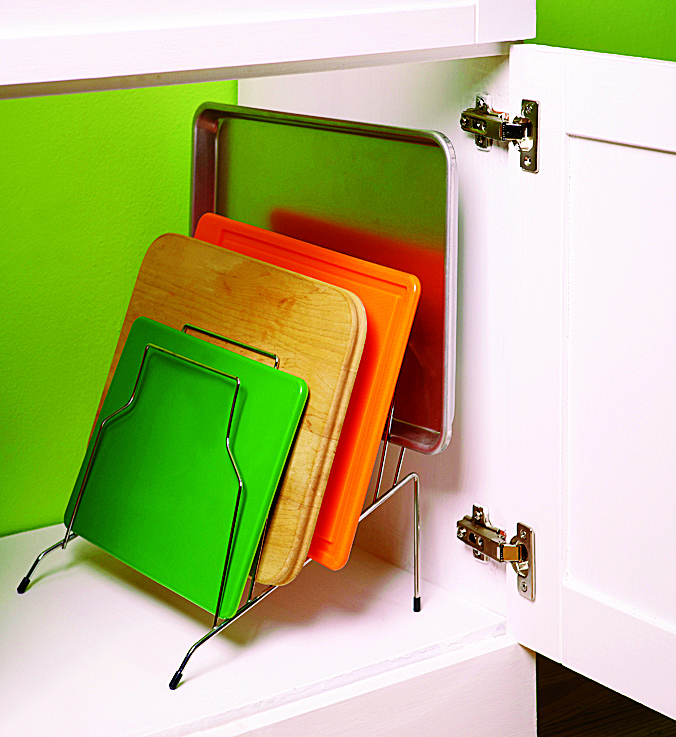 cutting boards organized in cabinet