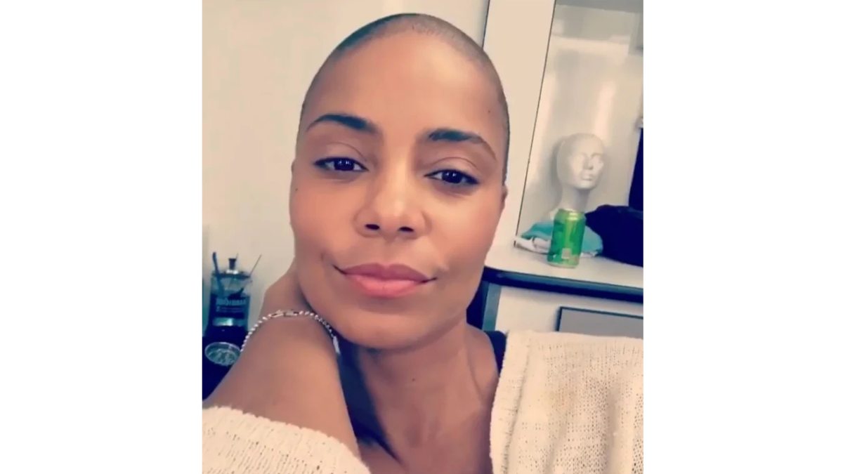 Sanaa Lathan taking a selfie with shaved hair