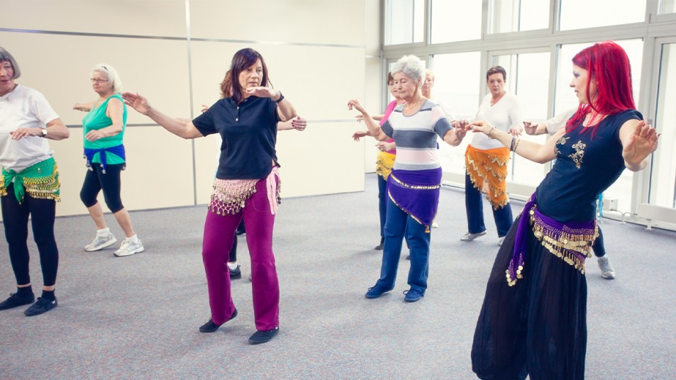 Woman taking belly dancing classes