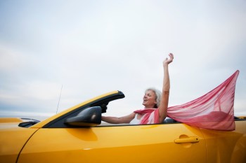 Mature woman driving a convertible