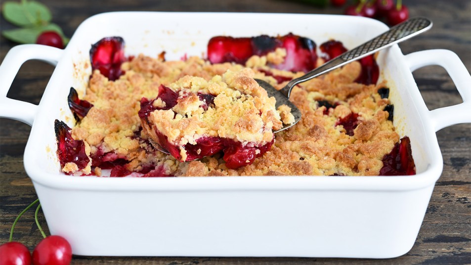 A baking dish with cherry pineapple dump cake