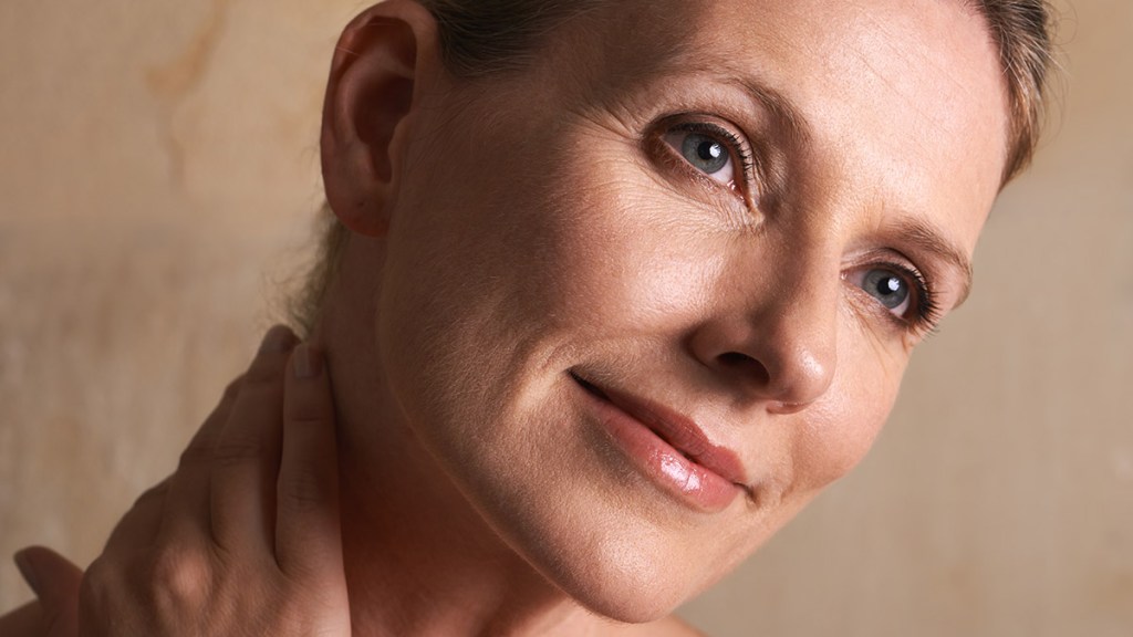 A woman who is in her 50s and has smooth skin thanks to hyaluronic acid