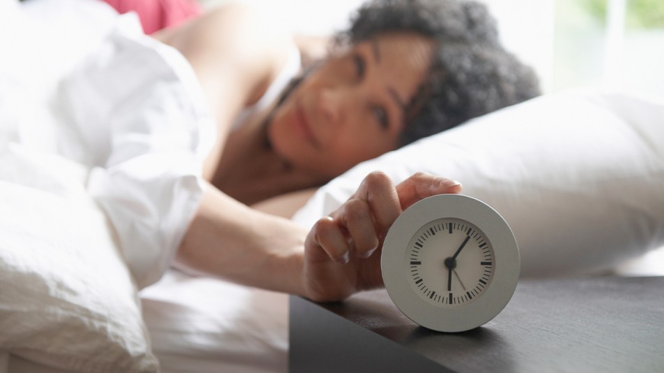 Woman turning off her alarm