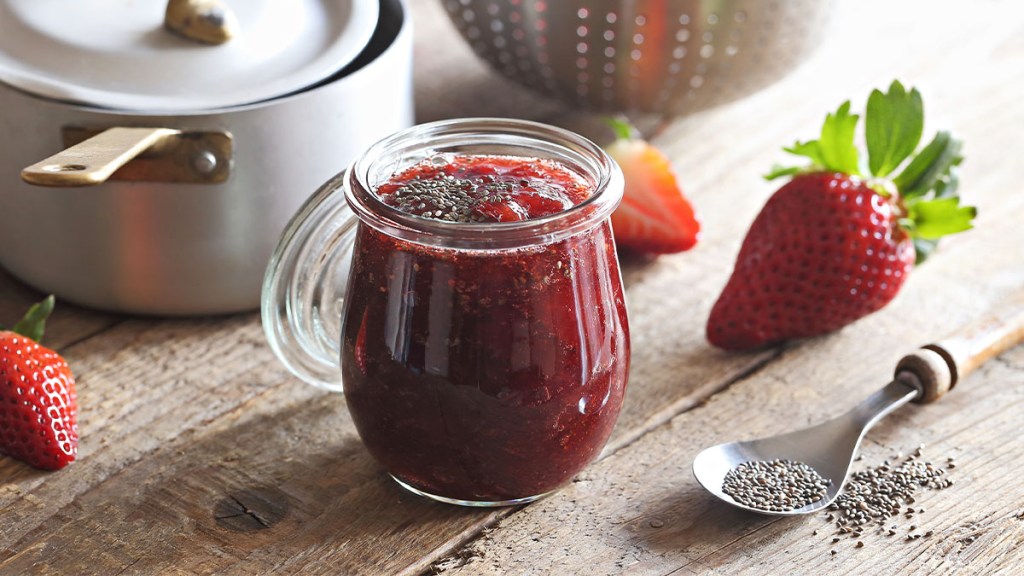 Glass jar of strawberry jam made with chia seeds for weight loss