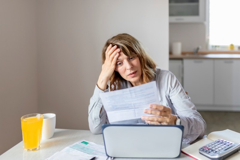 stressed mature woman worried about money