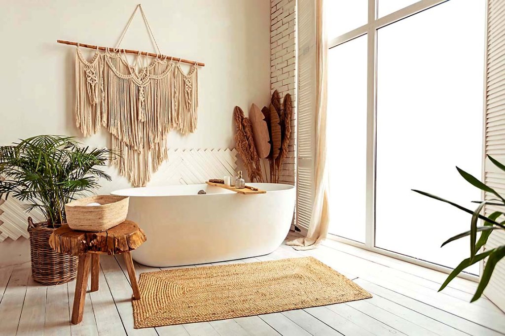 beige spa bathroom with wall hanging