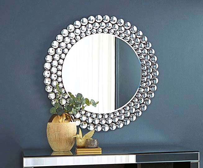 decorative circle mirror on blue wall