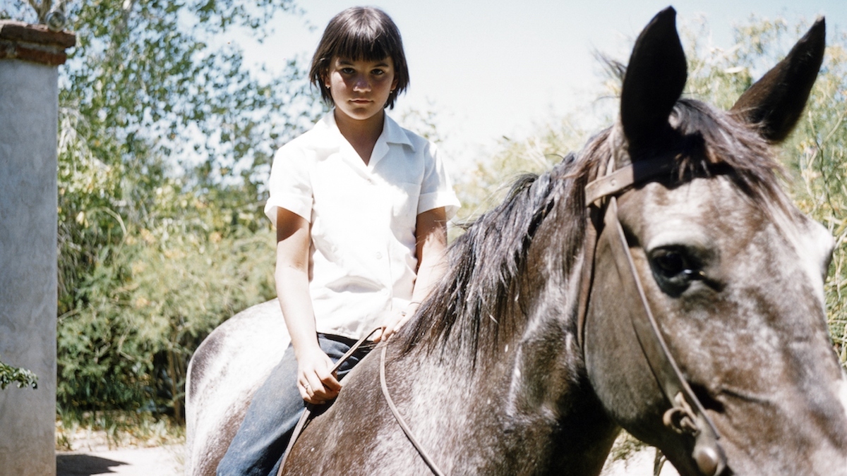 Young Linda Ronstadt on horseback