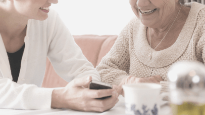 caregiver helping senior citizen