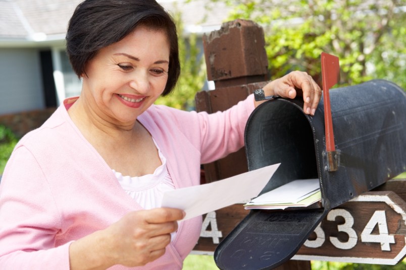 Mature woman checking her mailbox
