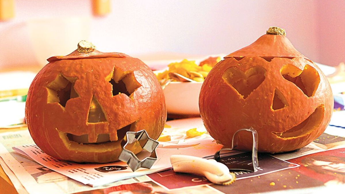 pumpkins carved using cookie cutters