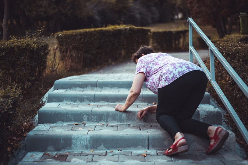 Woman falling on stairs