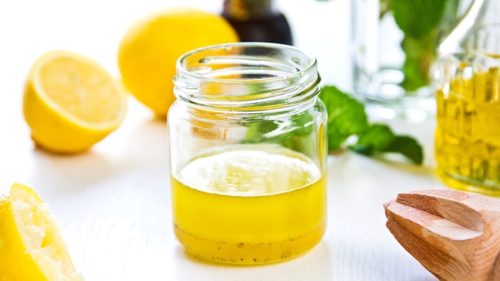 A jar of lemon juice infused into olive oil for maximum health benefits